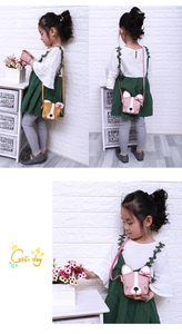 Detail view of cute puppy crossbody bags with bowties in ginger and pink PU leather