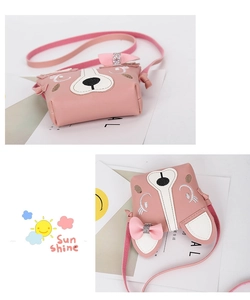 Detail of pink cartoon animal shoulder bag featuring sequins and embroidered eyes
