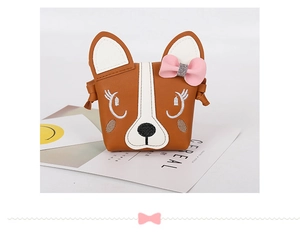 Close-up of cute dog face child bag with pink bow and embroidered details on PU leather