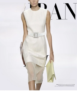 Detailed view of white sleeveless mini dress featuring a matching wide square buckle belt