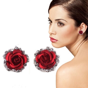Detail of red rose earrings with rhinestones showing both close-up and model on ear