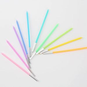 Colorful long rainbow birthday candles with silver metal bases on white background