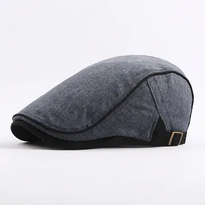 Classic gray-blue cotton newsboy cap with black adjustable strap and metal buckle