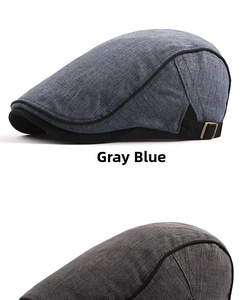 Detail of gray blue cotton beret hat featuring metal buckle and breathable fabric texture