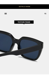 Close-up of a high-quality glossy black square frame with wide temples and blue lenses