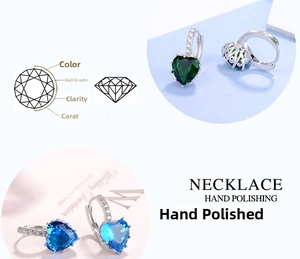 Detailed view of heart-cut gemstone earrings with emerald and sapphire zircon stones