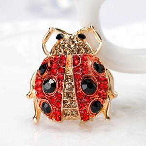 Exquisite ladybug brooch with vibrant red and black crystals set in gold-plated alloy