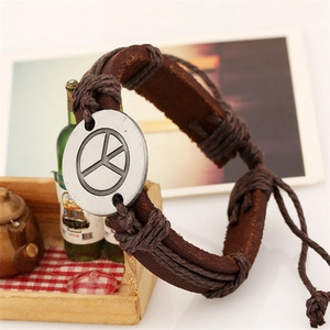 Handmade leather rope bracelet with metal peace symbol in a vintage brown woven design