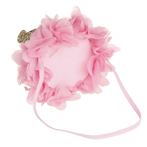 Detail of pink mesh flower headband for babies with gold accents on white background