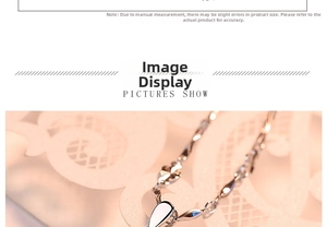 Macro shot of silver drop pendant with intricate floral hollow-out chain detail