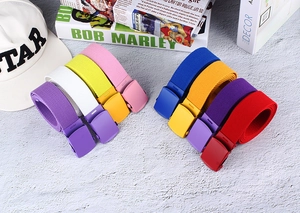 Close-up of colorful nylon woven belts featuring matching matte buckles in eight colors