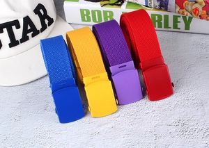 Flat lay of colorful nylon canvas belts with matching spray-painted smooth buckles