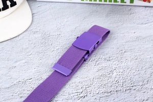 Detailed top view of purple nylon canvas belt with matching matte metal buckle on grey base