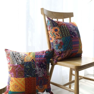 Bohemian ethnic cotton linen cushion covers with tassels in a bright sunlit interior