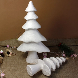 Close-up of white styrofoam Christmas tree models for DIY crafts on burlap background