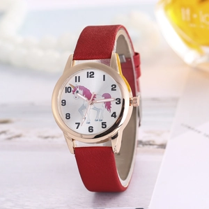 Detail of rose gold quartz watch with unicorn dial and red frosted leather strap