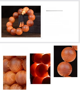 Macro detail of hand-polished blood wood prayer beads with natural textures and gourd charm