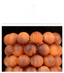 Macro detail of natural wood beads showing distinct annual ring texture and grain