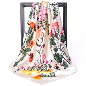 Detailed view of the morning glory floral print on a silky 90x90cm satin square scarf