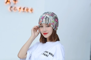 Detail of trendy floral print slouchy beanie for women made of thin breathable fabric