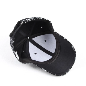 Interior detail of black canvas baseball cap with white lining and washing label