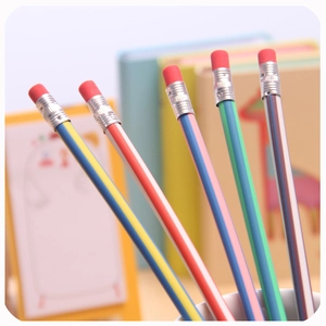 Set of five colorful striped pencils with pink erasers displayed in a pencil holder