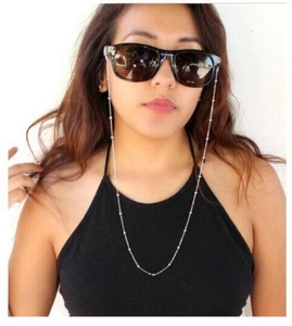 Silver bead eyewear chain strap shown on model for a stylish lifestyle look