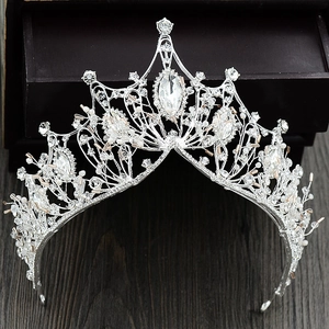 Detailed macro view of baroque silver tiara featuring marquise crystals and beads