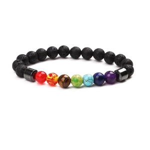 Detailed close-up of lava stone beads and colorful chakra gemstones on a beaded bracelet