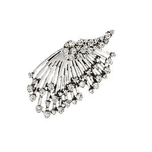 Silver alloy feather ear cuff with sparkling crystals and antique finish on white background