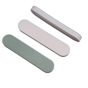 Three professional nail buffer blocks with multiple grit surfaces on a white background