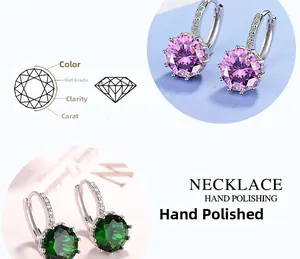 Detailed view of silver hoop earrings featuring purple and green zircon stone settings