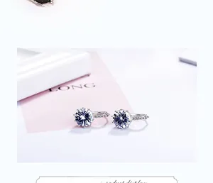 Detailed macro view of silver hoop earrings with sparkling round cubic zirconia stones