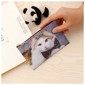 Close-up of cute cat print coin purse with metal zipper ring and textured faux leather