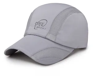 Detail of grey quick-dry sports cap showing breathable side mesh and SPORT text