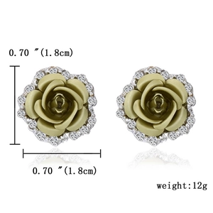Macro view showing 1.8cm olive green flower earrings with white zircon accents