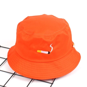 Detailed embroidery of cigarette icon on bright orange polyester bucket hat