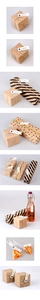 Detail showing handmade labels on kraft boxes and gift packaging with twine