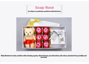 Detail of soap rose gift box with pink gradient flowers and a cute teddy bear decoration
