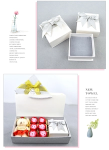 Detail of red soap roses, plush bear, and white jewelry box with ribbon gift set