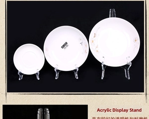 Detailed view of clear acrylic display stands showing triangular structure for ceramic plates