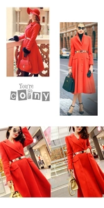 Detailed view of women's red wool coat with a shiny gold metal belt and fur cuffs