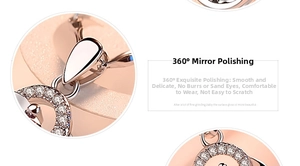 Detail of 360-degree mirror polished silver clover pendant with sparkling zircon accents