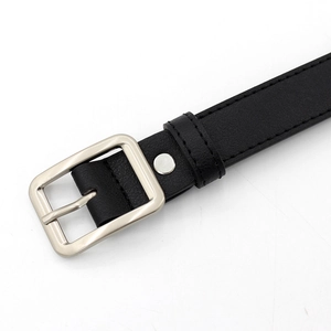 Women's black leather belt with a classic silver metal pin buckle on white background