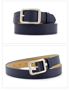 Macro detail of dark blue leather belt showing silver buckle and stitching texture
