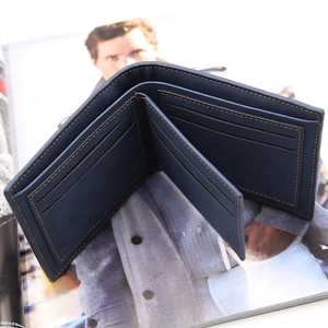 Navy Saffiano leather men's bifold wallet with contrast orange stitching and card slots