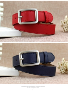 Detail of red and navy blue PU leather belts with matte silver square metal buckles