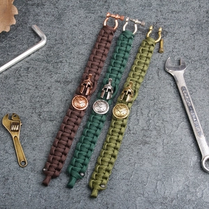 Outdoor survival paracord bracelets with Spartan helmet charms and metallic U-shackles
