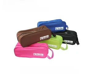 Close-up of waterproof travel shoe bags in multiple colors with zipper and top handle
