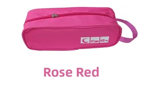 Rose red waterproof travel shoe bag with zipper closure and white Shoes logo detail